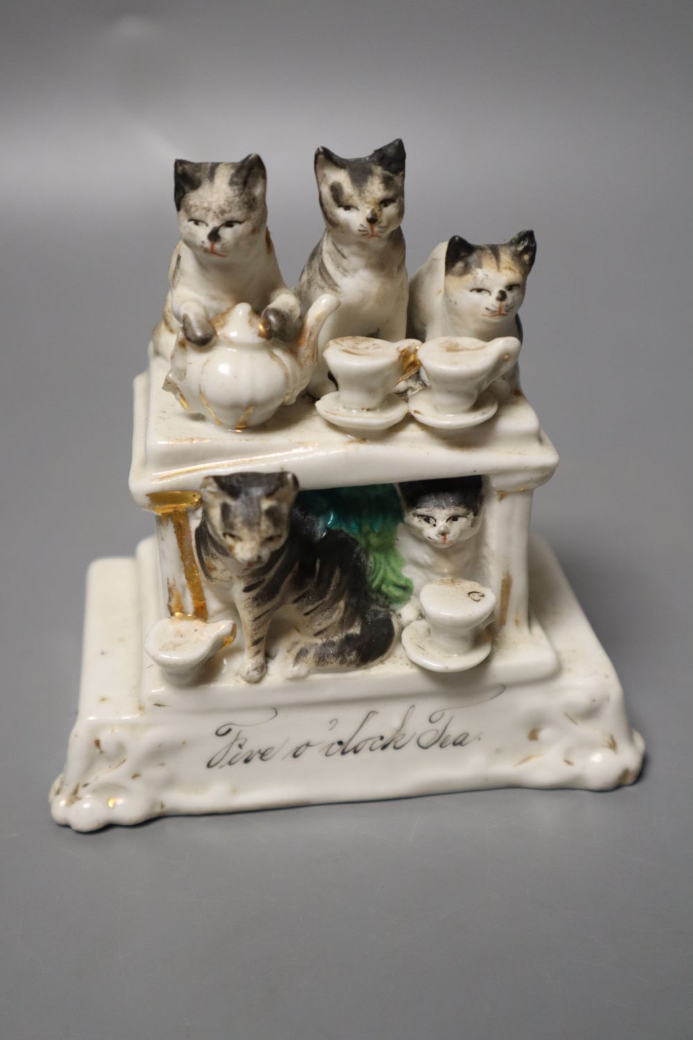 A humorous group of five cats having Five oclock Tea and a pottery sheep group, 9cm